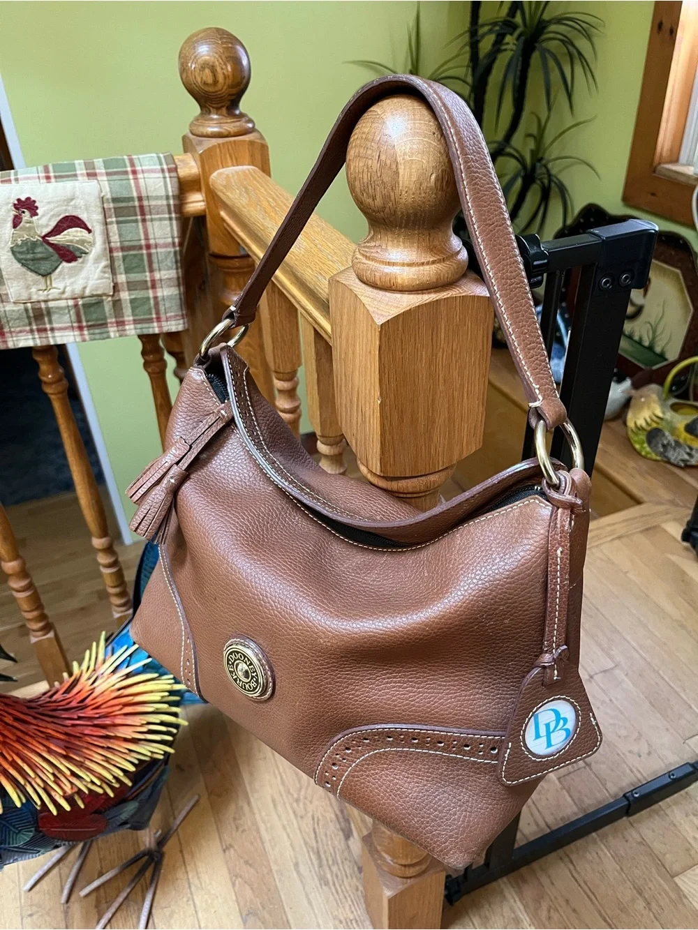 Dooney & Bourke Camel Brown Pebbled Leather Shoulder Bag with Tassel Emblem